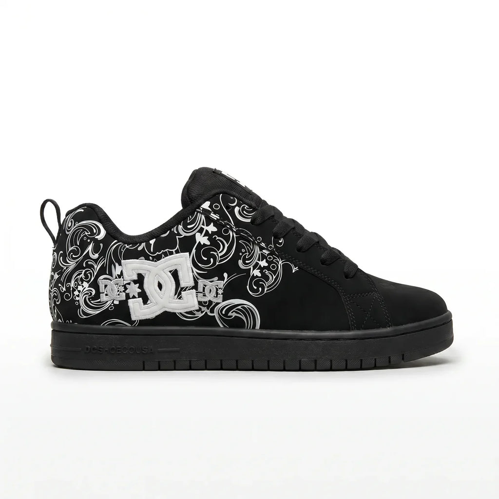 Black sneaker with white floral patterns and DC logo on a white background